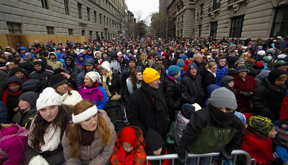 People try to watch the 88th Macy's Thanksgiving Day Parade in New York