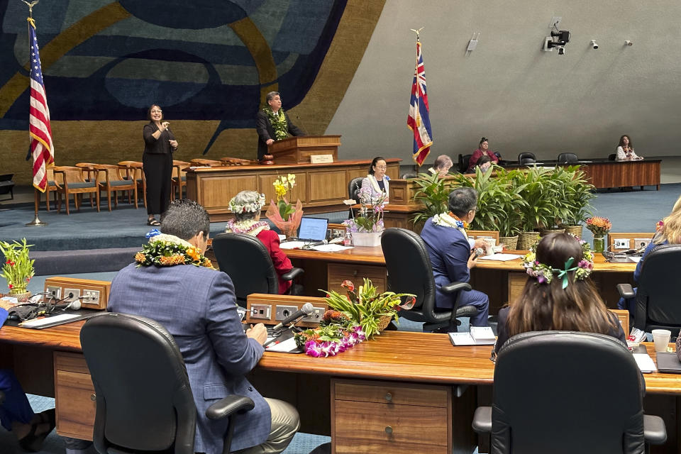 Hawaii Senate President Ron Kouchi, top left, speaks to senators at the Hawaii State Capitol on Wednesday, Jan. 17, 2024, in Honolulu. Hawaii lawmakers on Wednesday opened a new session of the state Legislature vowing to address glaring problems laid bare by the deadly wildfire that destroyed the historic town of Lahaina in August: the threat posed by wildfires and the lack of affordable housing. (AP Photo/Audrey McAvoy)