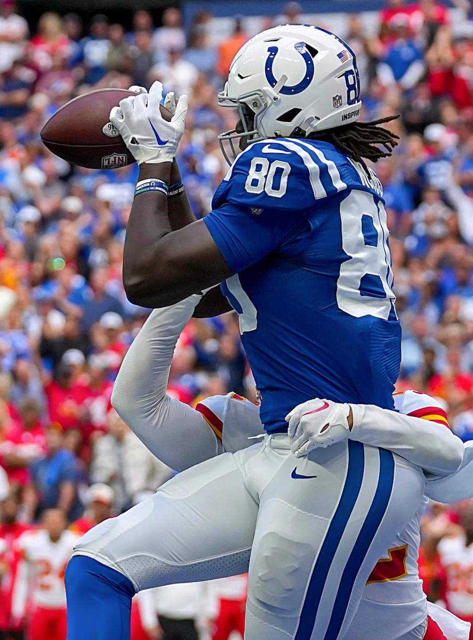 Indianapolis Colts tight end Jelani Woods (80) catches a touchdown pass while being guarded by Kansas City Chiefs safety Juan Thornhill (22) on Sunday, Sept. 25, 2022, during a game against the Kansas City Chiefs at Lucas Oil Stadium in Indianapolis.