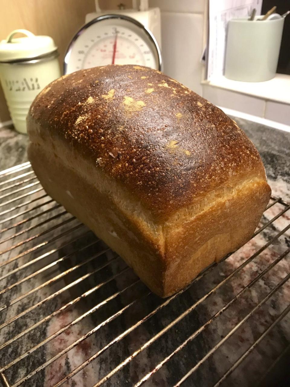 A freshly-baked loaf of white bread cools off on a wire rack at a home in London. With millions of people across the globe working at home due to lockdown measures imposed during the coronavirus pandemic, many people are choosing to make their own bread, rather than venturing to the local store to buy their weekly fix. (Matt Kemp via AP)