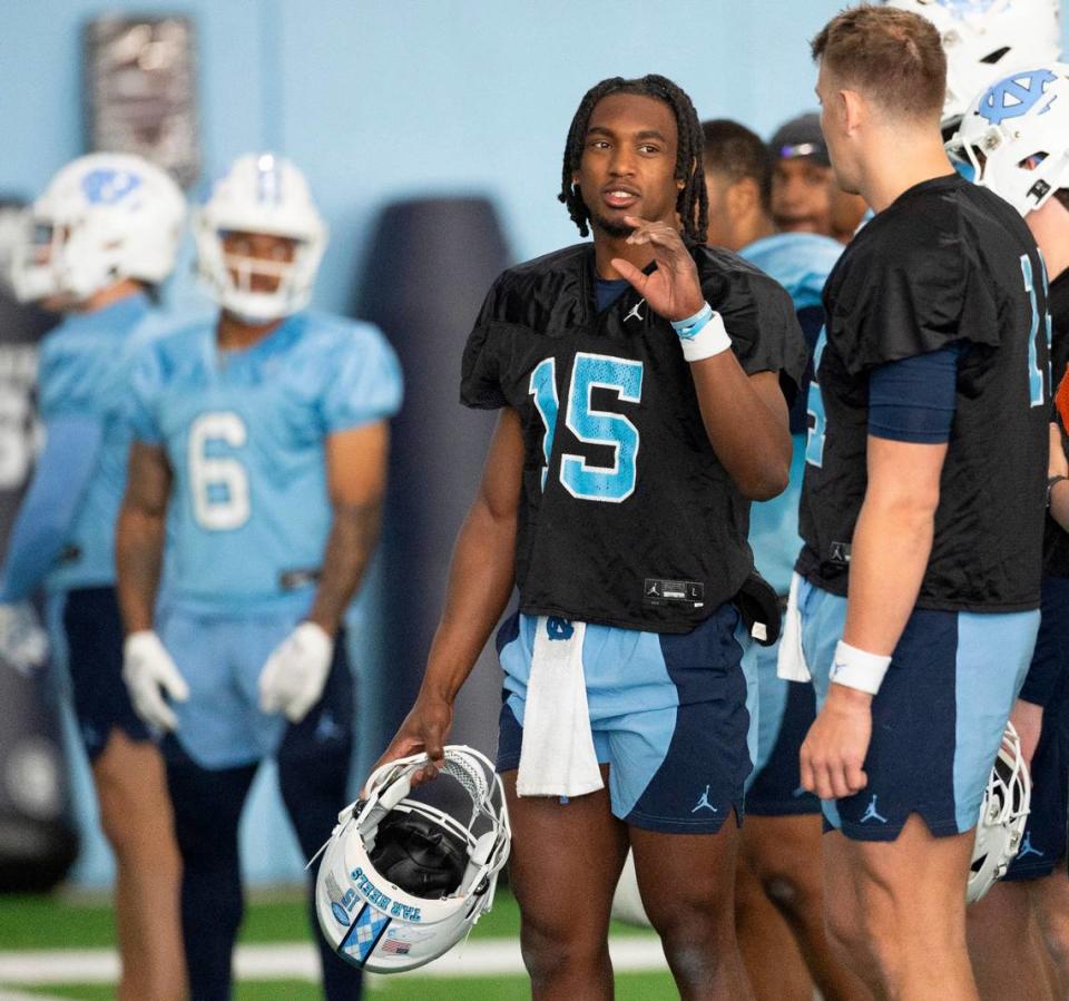 North Carolina sophomore quarterback Conner Harrell (15) talks with graduate transfer quarterback Max Johnson (14) during the Tar Heels’ opening day of spring football practice on Tuesday, March 19, 2024 in Chapel Hill, N.C.