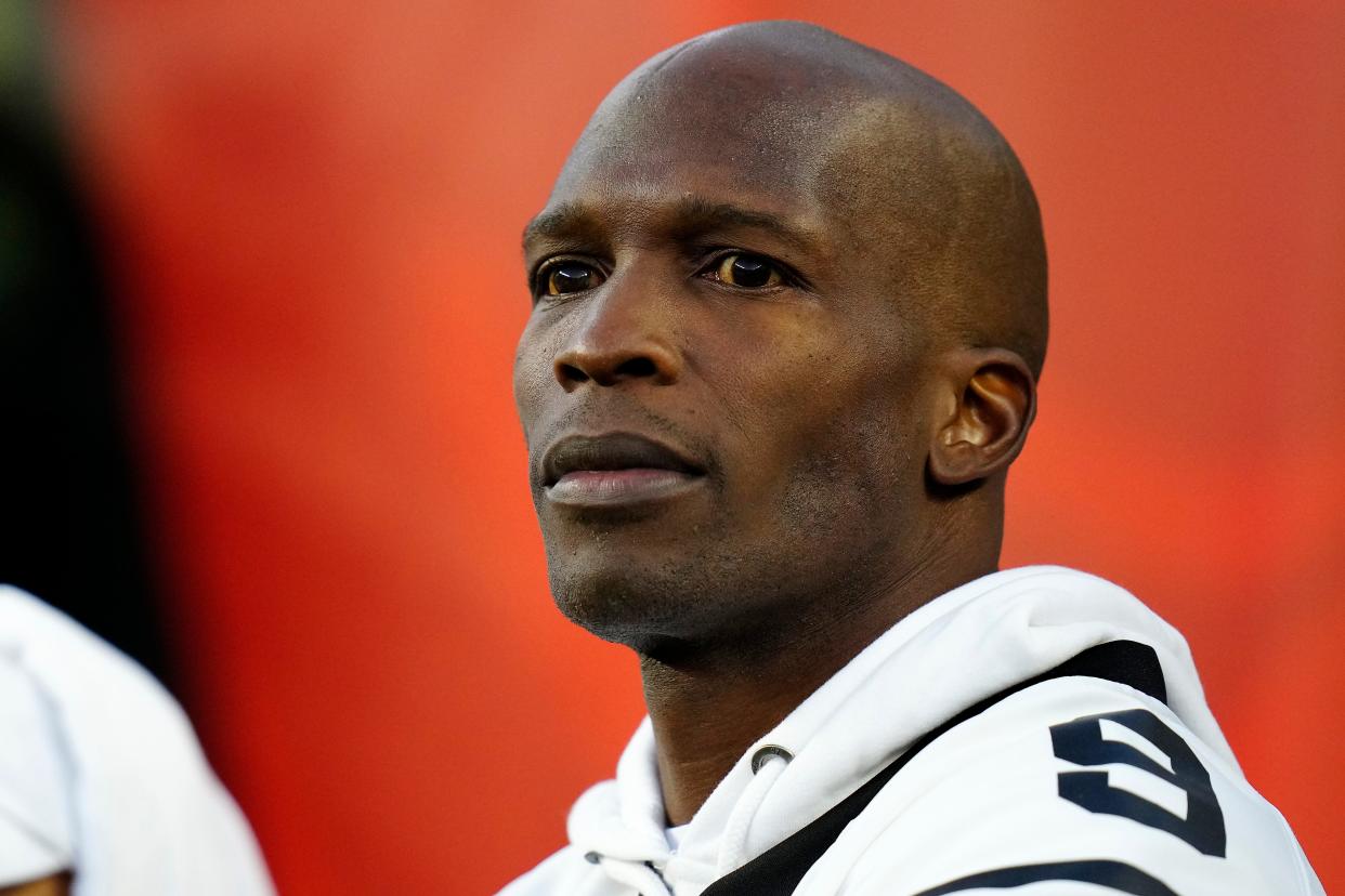 Former Bengals Chad Johnson watches warmups before the first quarter of the NFL Week 4 game between the Cincinnati Bengals and the Miami Dolphins at PayCor Stadium in downtown on Thursday, Sept. 29, 2022.