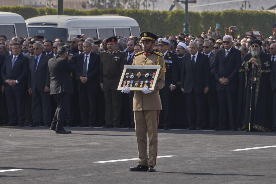 Dignitaries attend the funeral of former autocratic President Hosni Mubarak at Tantawi Mosque, in eastern Cairo, Egypt, Wednesday, Feb. 26, 2020. Egypt is holding a full-honors military funeral for Mubarak who was ousted from power in the 2011 Arab Spring uprising. The 91-year-old Mubarak died on Tuesday at a Cairo military hospital from heart and kidney complications. (AP Photo/Hamada Elrasam)