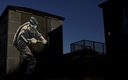 A mural is seen on a block of flats in the Bogside area of Londonderry, Northern Ireland