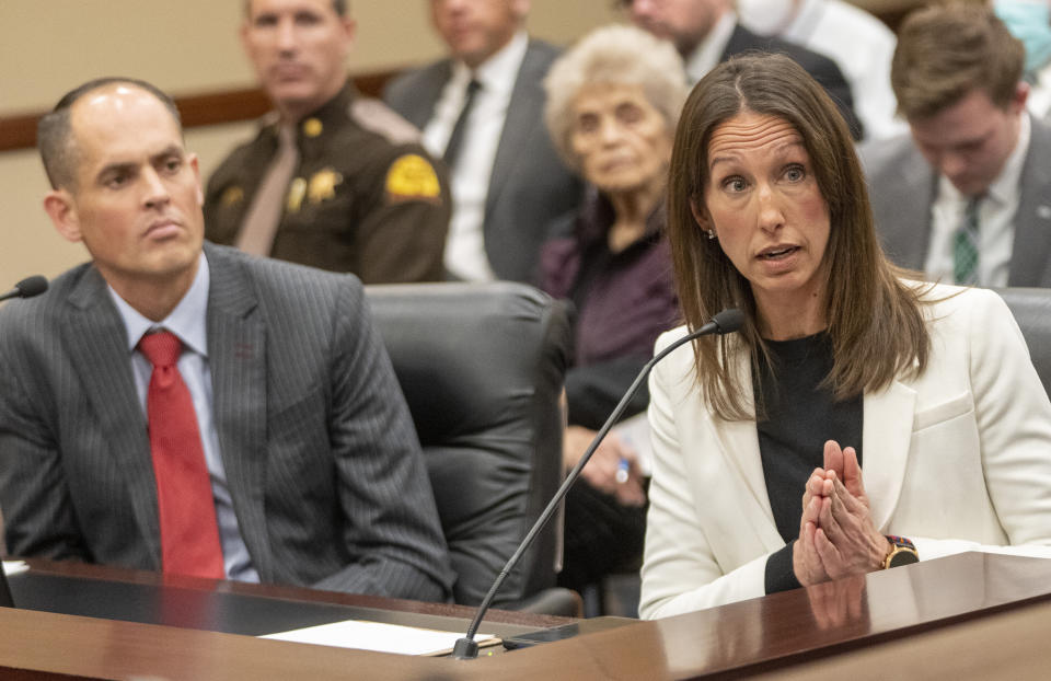 Resolution sponsor state Sen. Mike McKell,left, listens as Salt Lake Tribune Executive Editor Lauren Gustus appears in front of the Senate Business and Labor Committee speaking in opposition of SR1, which will limit media access to the Senate floor and committee rooms, at the Capitol, on Wednesday, Feb. 9, 2022, in Salt Lake City. Utah's state Senate passed rules this week limiting where the press can go to report in statehouses, marking the latest move by Republican state lawmakers departing from centuries-old traditions to make pandemic-era limits on access to chambers permanent. Newspaper executives and press advocates have opposed the changes, arguing they inhibit accountability reporting and limit transparency. (Rick Egan/The Salt Lake Tribune via AP)