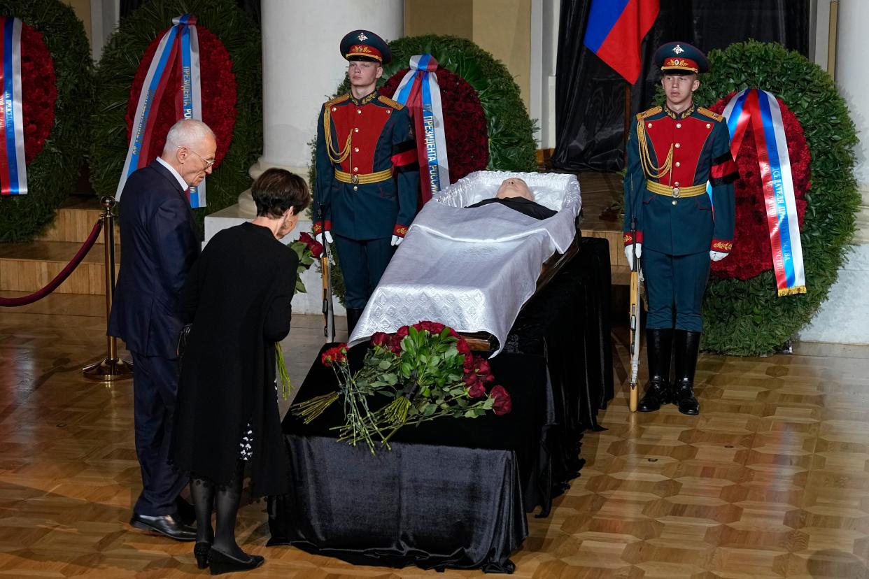 People stand by the coffin of former Soviet President Mikhail Gorbachev inside the Pillar Hall of the House of the Unions during a farewell ceremony in Moscow, Russia, Saturday, Sept. 3, 2022. 