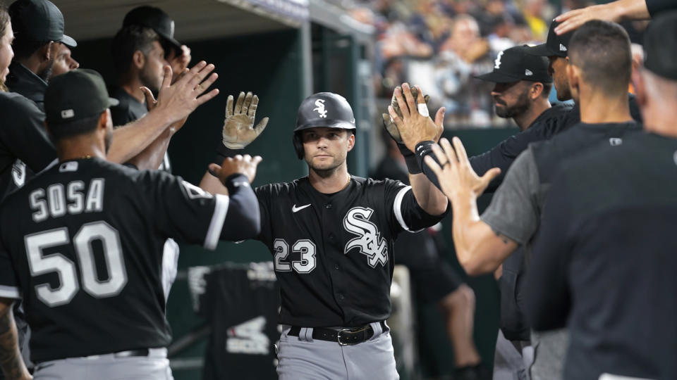 Chicago White Sox's Andrew Benintendi (23) celebrates scoring against the Detroit Tigers in the eighth inning of a baseball game, Friday, Sept. 8, 2023, in Detroit. (AP Photo/Paul Sancya)