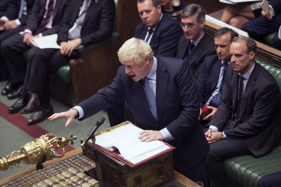 In this handout photo provided by the House of Commons, Britain's Prime Minister Boris Johnson gestures during his first Prime Minister's Questions, in the House of Commons in London, Wednesday, Sept. 4, 2019. Britain's Parliament is facing a second straight day of political turmoil as lawmakers fought Prime Minister Boris Johnson's plan to deliver Brexit in less than two months, come what may. Johnson is threatening to dissolve the House of Commons and hold a national election that he hopes might produce a less fractious crop of legislators. (Jessica Taylor/House of Commons via AP)