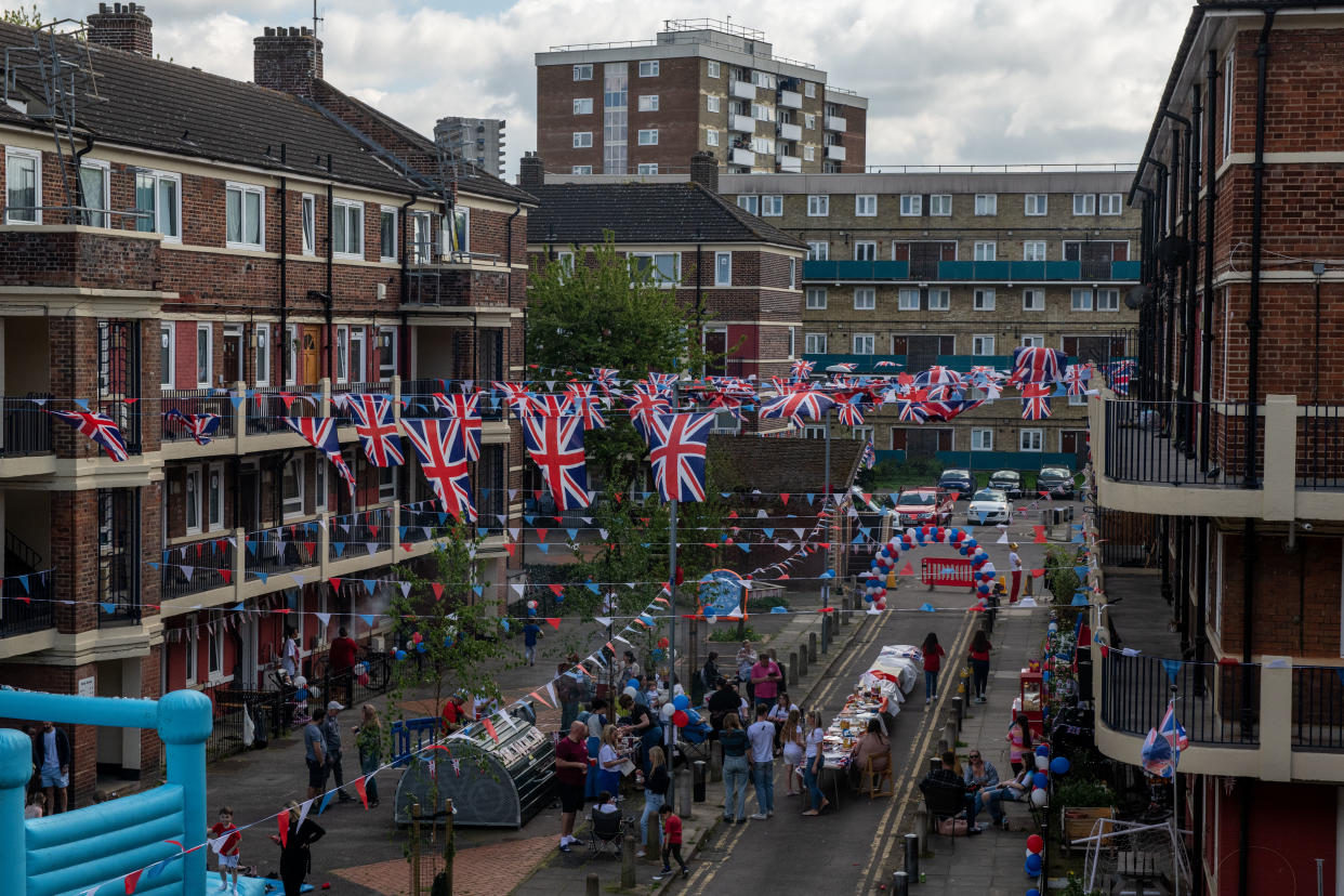 Residents hold a street party on the Kirby Estate (Getty)