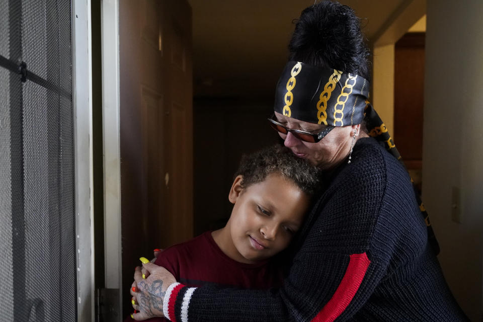 Kim Carlson, right, hugs her 9-year old grandson Treveyon Carlson at her apartment at the Delta Pines complex, Friday, Nov. 4, 2022, in Antioch, Calif. Despite a landmark renter protection law approved by California legislators in 2019, tenants across the country’s most populous state are taking to ballot boxes and city councils to demand even more safeguards. They want to crack down on tenant harassment, shoddy living conditions and unresponsive landlords that are usually faceless corporations. (AP Photo/Godofredo A. Vásquez)