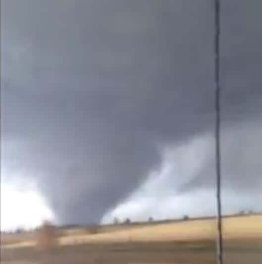  Karla Konieczki’s first time to witness a tornado was certainly dramatic. Driving just south of Minonk, Illinois, on November 17, she had this close shave with a large tornado on a day when stormy conditions played havoc in the Midwest. Credit: Facebook/Karla Konieczki 