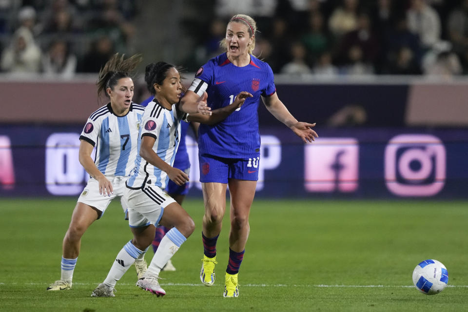 U.S. midfielder Lindsey Horan, right, and Argentina midfielders Miriam Mayorga, center, and Romina Nuñez vie for the ball during the second half of a CONCACAF Gold Cup women's soccer tournament match Friday, Feb. 23, 2024, in Carson, Calif. (AP Photo/Ryan Sun)