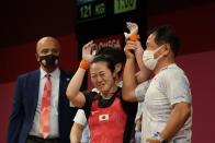 Mikiko Andoh of Japan celebrates after the last lift in the women's 59kg weightlifting event, at the 2020 Summer Olympics, Tuesday, July 27, 2021, in Tokyo, Japan. (AP Photo/Luca Bruno)