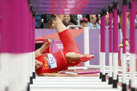 China's Liu Xiang falls after crashing into the first hurdle during his men's 110m hurdles round 1 heat at the London 2012 Olympic Games at the Olympic Stadium August 7, 2012. REUTERS/Lucy Nicholson (BRITAIN - Tags: OLYMPICS SPORT ATHLETICS TPX IMAGES OF THE DAY) 