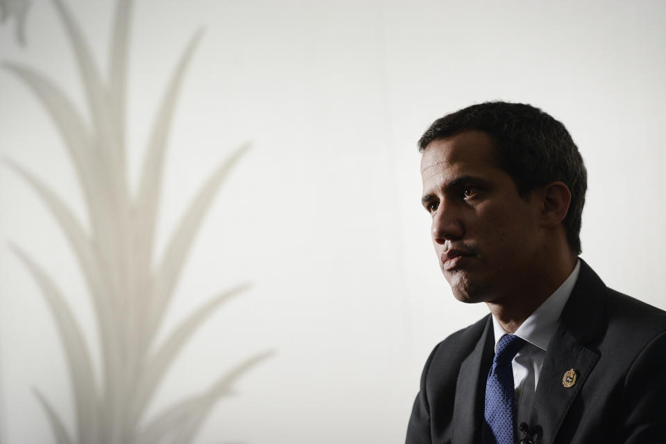 In this Dic. 16, 2019 photo, Cenezuela's National Assembly President and self-proclaimed interim President Juan Guaido speaks during a interview with the Associated Press in Caracas, Venezuela. The United States and dozens of nations have thrown their support behind the youthful congressional leader, recognizing him as the country's legitimate president, arguing that President Nicolas Maduro's recent reelection had been invalidated by fraud and a ban on most opponents. (AP Photo/Matias Delacroix, File)