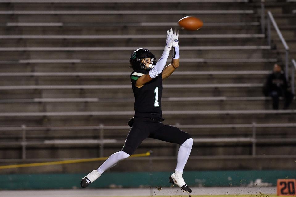 Choctawhatchee High School's Jayce Brown reels in a pass to help the Indians on a drive for their second touchdown against Rickards High School during Friday night's game at Joe Etheredge Stadium. Rickards won the game 34-28.