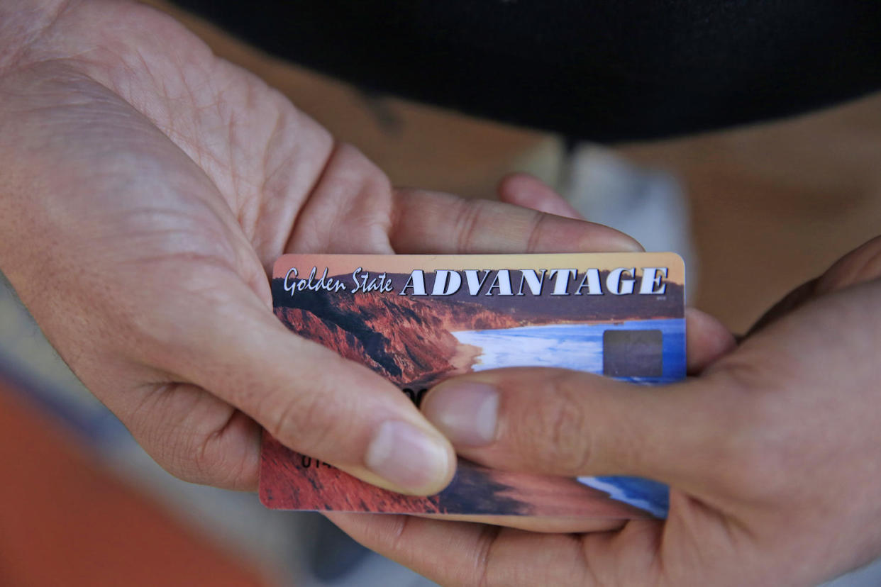 A California resident holds his EBT card. (San Francisco Chronicle via Getty Images)