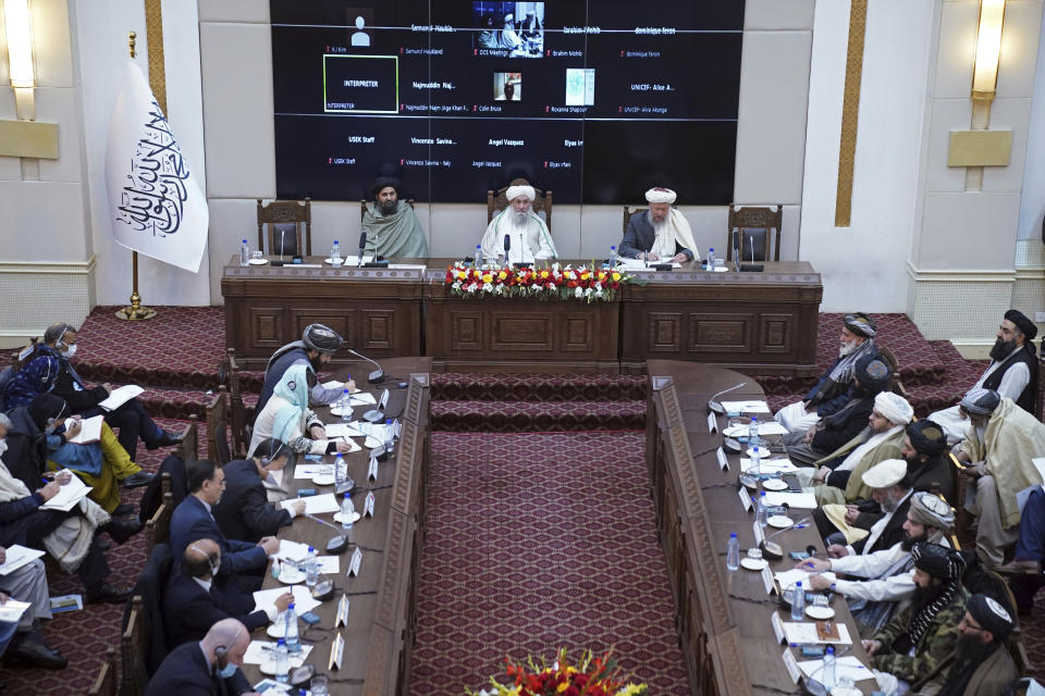 CORRECTS SPELLING OF PRIME MINISTER FROM HASSAN TO HASAN -- Taliban Prime Minister Mohammad Hasan Akhund, center, speaks during an economic conference at the former Presidential Palace in Kabul, Afghanistan, Wednesday, Jan. 19, 2022. Even as Afghanistan faces a humanitarian catastrophe and its economy teeters on the brink of collapse, the United Nations representative on Wednesday told a Taliban-organized economic conference in the capital Kabul there have been some advances, including a surprising $1 billion in exports. (Taliban Prime Minister Media Office via AP)