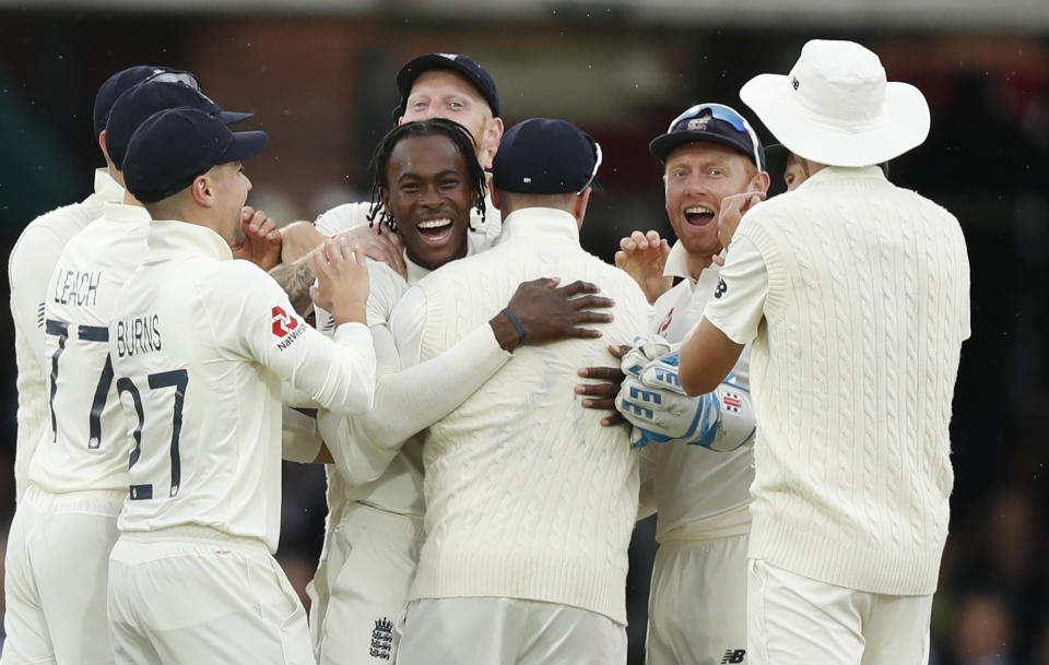 England's Jofra Archer, centre, celebrates after taking the wicket of Australia's Cameron Bancroft lbw on day three of the 2nd Ashes Test cricket match between England and Australia at Lord's cricket ground in London, Friday, Aug. 16, 2019. (AP Photo/Alastair Grant)