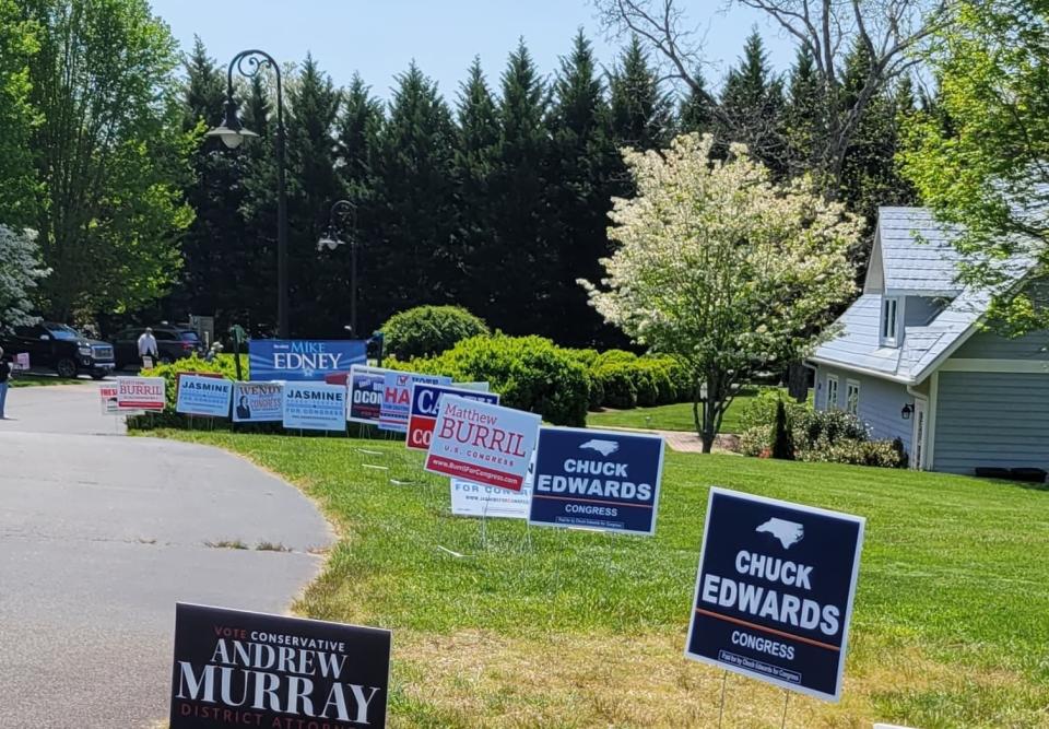 Candidate signs are seen at Flat Rock's Village Hall earlier this year.