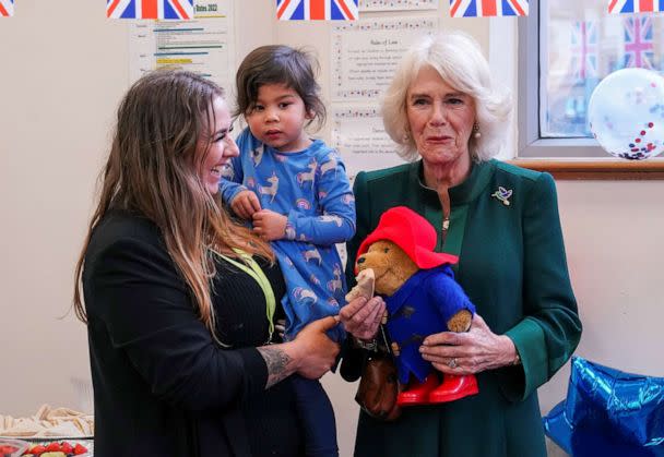 PHOTO: Camilla, the Queen consort, holds a Paddington bear during a visit to Barnardo's Nursery in London, Nov. 24, 2022.  (Pool via Reuters)