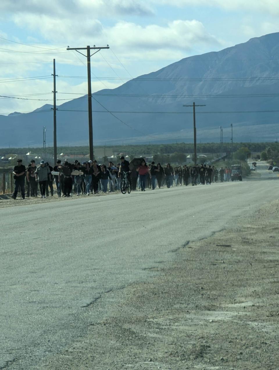 About 100 students from Desert Mirage High School march six miles to the Coachella Valley Unified School District headquarters to protest school security issues and teacher pay on Feb. 28. As they walked, their high school and two adjacent campuses went on lockdown for two hours after a student turned in to administrators a gun magazine loaded with bullets.