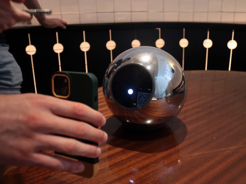 The Worldcoin Orb scans a QR code to kick off the iris scan. (Eliza Gkritsi/CoinDesk)