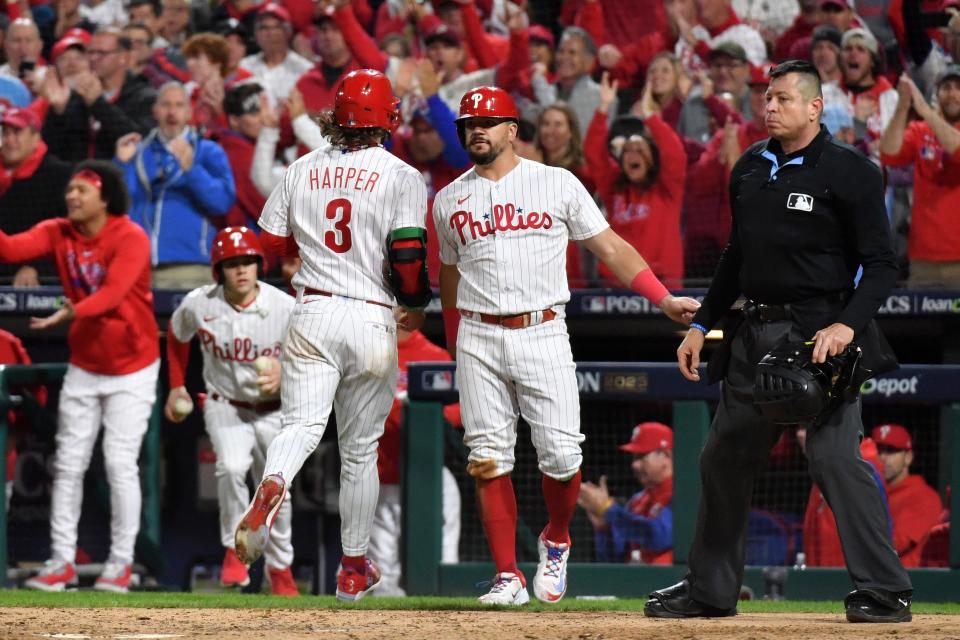 Oct 17, 2023; Philadelphia, Pennsylvania, USA; Philadelphia Phillies first baseman Bryce Harper (3) reacts with left fielder Kyle Schwarber (12) during the seventh inning for game two of the NLCS for the 2023 MLB playoffs against the Arizona Diamondbacks at Citizens Bank Park. Mandatory Credit: Eric Hartline-USA TODAY Sports