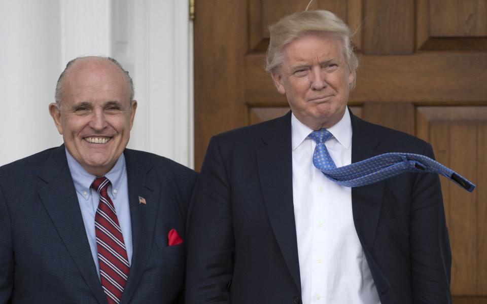 Donald Trump with Rudy Giuliani  - AFP