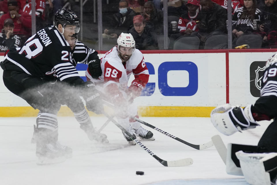 Detroit Red Wings' Sam Gagner (89), center, tries to get off a shot during the second period of an NHL hockey game against the New Jersey Devils in Newark, N.J., Friday, April 29, 2022. (AP Photo/Seth Wenig)