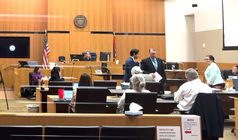 Bryan Miller returns to his seat after addressing Judge Suzanne Cohen on May 22, 2023.