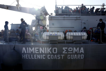 Greek Coast Guard vessel Agios Efstratios, carrying refugees and migrants following a rescue operation, moors at the port of the Greek island of Lesbos, February 8, 2016. Picture taken February 8, 2016. REUTERS/Giorgos Moutafis