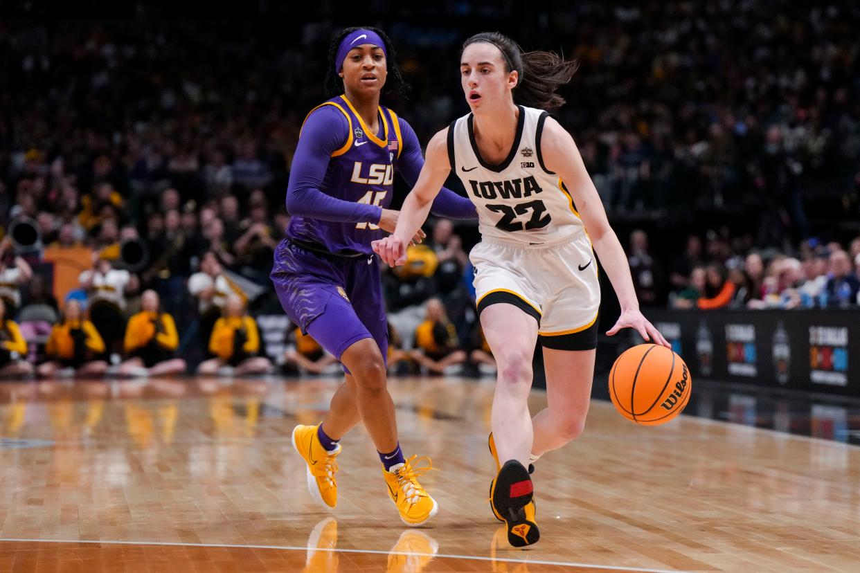 LSU guard Alexis Morris, left, defends against Iowa's Caitlin Clark in Sunday's women's NCAA championship game in Dallas.