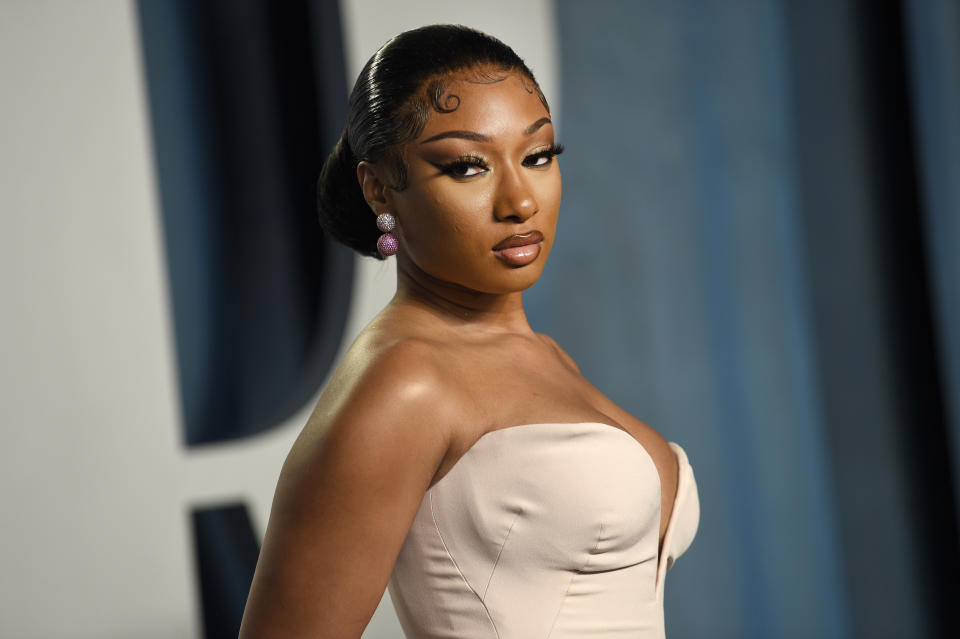 FILE - Megan Thee Stallion arrives at the Vanity Fair Oscar Party, March 27, 2022, at the Wallis Annenberg Center for the Performing Arts in Beverly Hills, Calif. Megan Thee Stallion is a three-time Grammy winner and hip-hop superstar, but her success hasn't been enough to shield the 27-year-old from the power of widespread misinformation campaigns and social media vitriol leveled against her after she was shot in 2020. (Photo by Evan Agostini/Invision/AP, File)