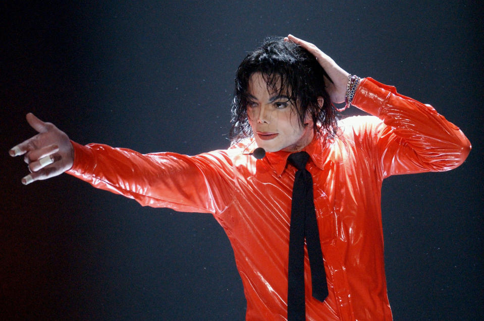 FILE - Michael Jackson performs "Dangerous" during the taping of the American Bandstand's 50th anniversary show on April 20, 2002, in Pasadena, Calif. With a series of court victories and shows beginning or returning after a long pandemic pause, Jackson's estate, and his legacy are on the upswing again. Estate co-executor John Branca said in an interview with The Associated Press that his optimism never flagged as crises hit. (AP Photo/Kevork Djansezian, File)