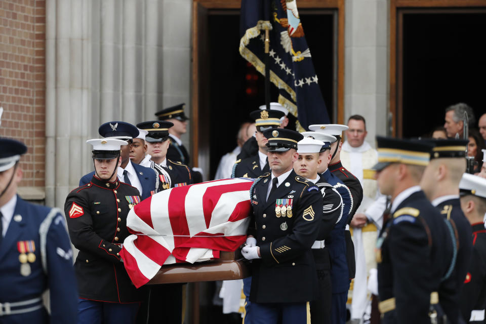 A military honor guard carries the flag-draped casket of former President George H.W. Bush from St. Martin’s Episcopal Church following his funeral service Thursday, Dec. 6, 2018, in Houston. (Photo: Gerald Herbert/AP)