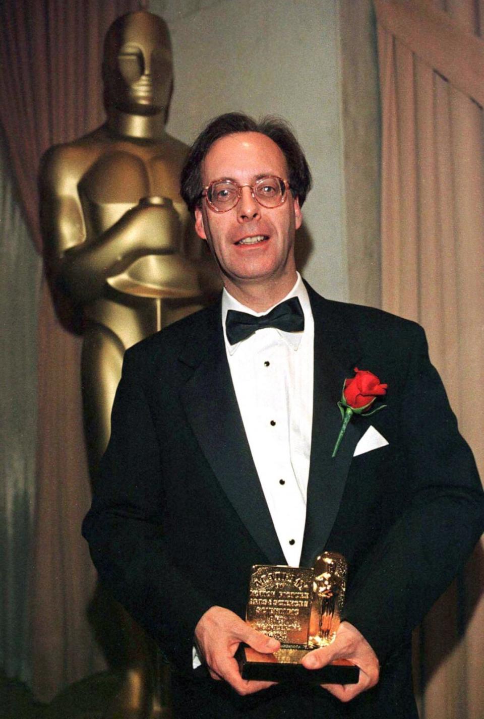 PHOTO: Iain Neil shows his Scientific and Engineering Oscar for the optical design of the Primo Series of spherical prime lenses for 35mm cinematography, following the Academy Awards ceremony, on Feb. 28, 1999. (Reuters, FILE)