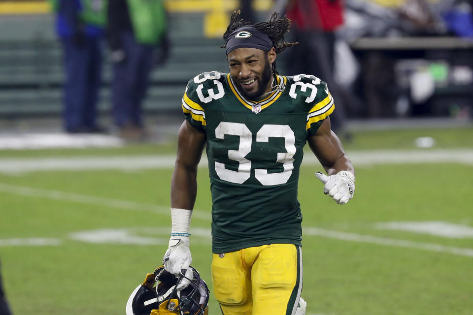 Green Bay Packers' Aaron Jones runs off the field after an NFL divisional playoff football game against the Los Angeles Rams Saturday, Jan. 16, 2021, in Green Bay, Wis. The Packers defeated the Rams 32-18 to advance to the NFC championship game. (AP Photo/Mike Roemer)