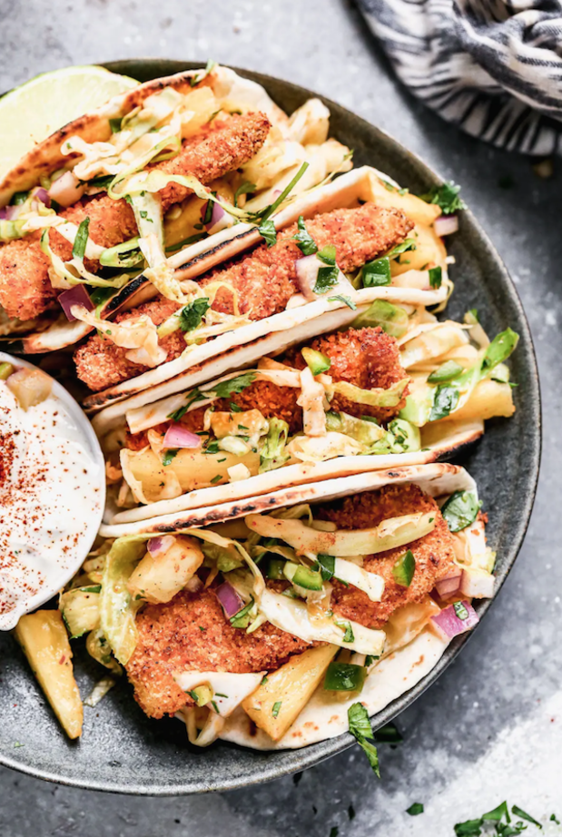 <p>Cooking for Keeps</p><p>Air fryer fish tacos produce the crispiest breaded fish without all the fat and calories and with all the flavor. We nestle the crunchy barramundi in charred street taco tortillas, top with a quick pineapple slaw and a fresh squeeze of lime juice.</p><p><strong>Get the recipe: <a href="https://www.cookingforkeeps.com/crispy-air-fryer-fish-tacos-with-pineapple-slaw/" rel="nofollow noopener" target="_blank" data-ylk="slk:Crispy Air Fryer Fish Tacos with Pineapple Slaw;elm:context_link;itc:0;sec:content-canvas" class="link ">Crispy Air Fryer Fish Tacos with Pineapple Slaw</a></strong></p>