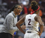 FILE - Atlanta Dream head coach Tanisha Wright, left, talks to guard Aari McDonald (2) during play against the Connecticut Sun during a WNBA basketball exhibition game Sunday, May 1, 2022, in Uncasville, Conn. weight becomes the first former player to be named AP coach of the year Tuesday, Aug. 16, 2022. (Sean D. Elliot/The Day via AP, File)