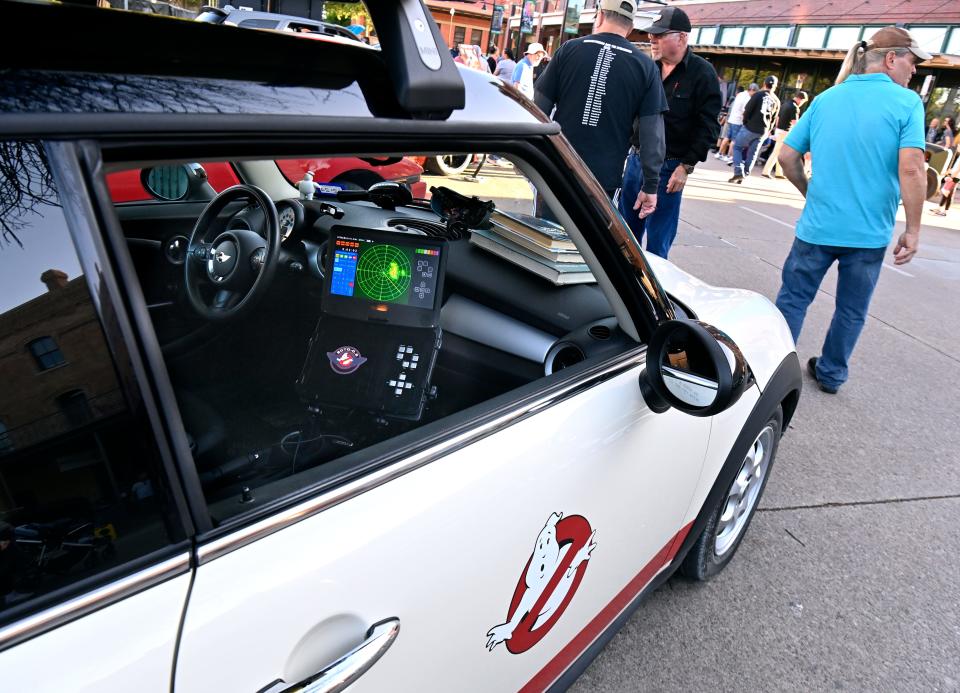 Lights blink and a “radar screen” shows potential danger inside David Rogers “Ecto-0.5”, a Ghostbusters-themed 2014 MINI Cooper Clubman at Thursday's CarWalk. Rogers said the car, complete with tanks on top and Proton Pack in the back, is a car he regularly drives around town.