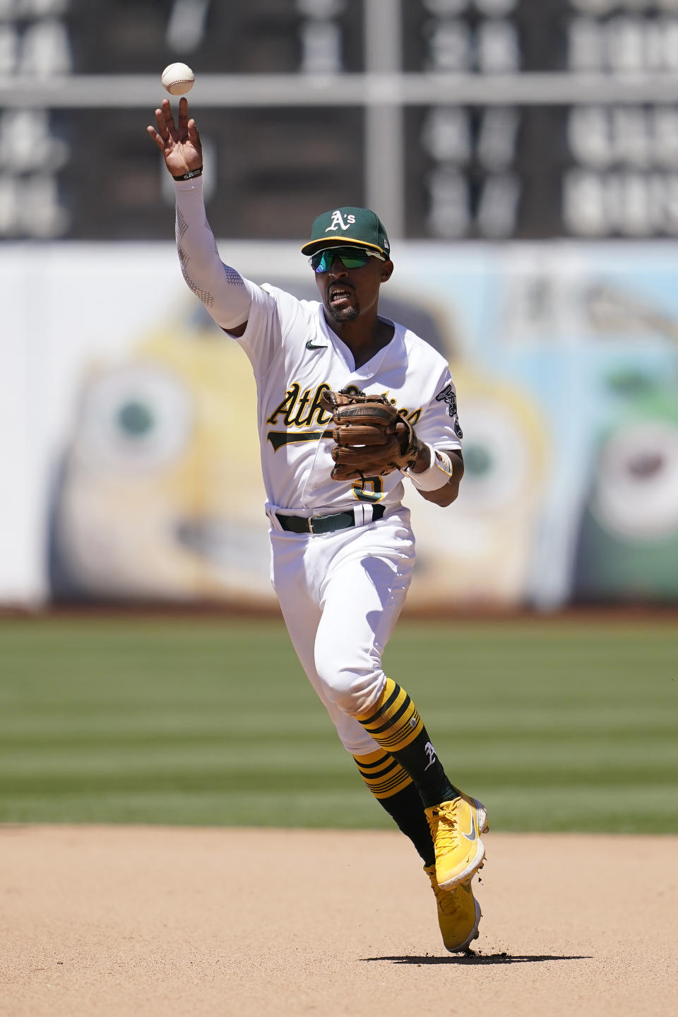 Oakland Athletics second baseman Tony Kemp throws out Houston Astros' Mauricio Dubon at first base during the seventh inning of a baseball game in Oakland, Calif., Wednesday, July 27, 2022. (AP Photo/Jeff Chiu)