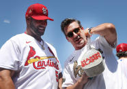 <p>Jon Hamm shows St. Louis Cardinals star Albert Pujols a 'Hamm Slamm' chain during batting practice before the T-Mobile Home Run Derby at Dodger Stadium on July 18 in L.A. </p>