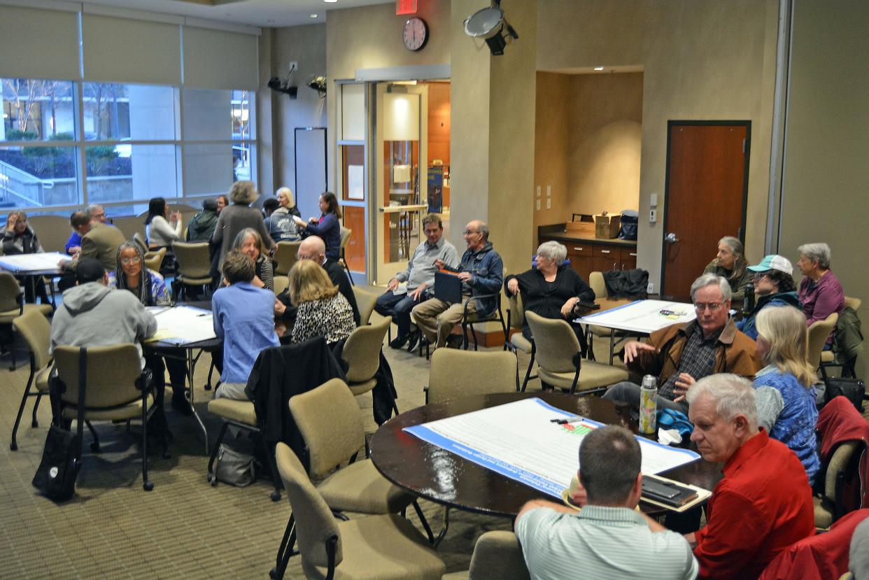 Community members fill a Columbia City Hall conference room Wedensday preparing to provide feedback as city staff work to prepare central Columbia urban conservation regulations.
