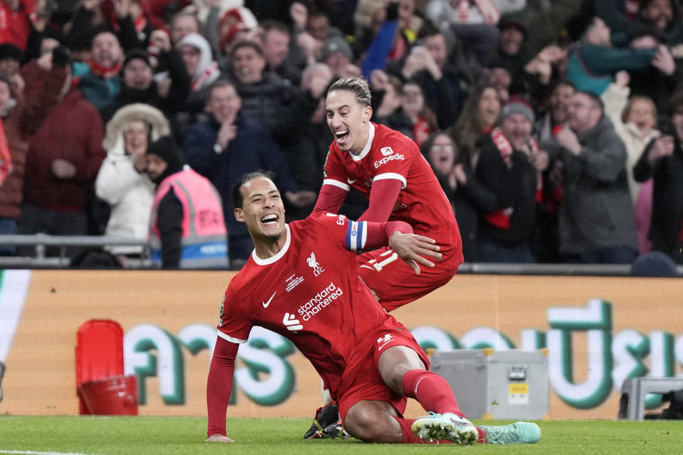 Liverpool's Virgil van Dijk celebrates after scoring his side's first goal during the English League Cup final soccer match between Chelsea and Liverpool at Wembley Stadium in London, Sunday, Feb. 25, 2024. (AP Photo/Alastair Grant)