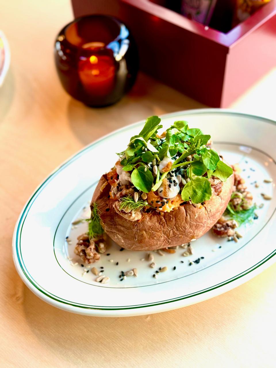 A stuffed sweet potato at Lincoln Yard topped with watercress.