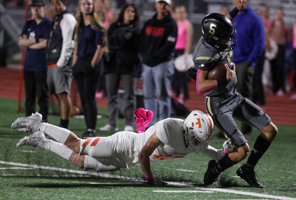 Timpview’s Haven Halliday pushes Maple Mountain’s Banks Jackson out of bounds during a varsity football game at Maple Mountain High School in Spanish Fork on Friday, Oct. 6, 2023. Timpview won 42-20. | Kristin Murphy, Deseret News