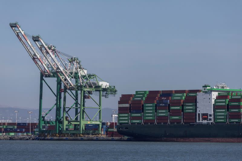FILE PHOTO: A cargo ship is seen near the port of Oakland, California