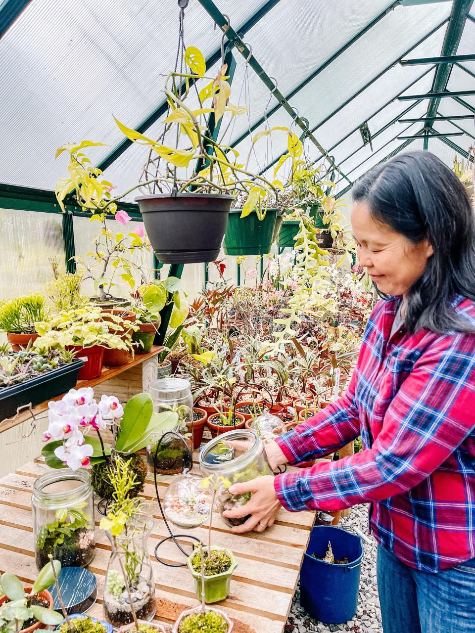 “We create terrariums and Kokedama moss balls with our hands. I don’t think there is a local market that sells those things in their storefront regularly,” said Terumi Watson, co-owner of Plant Curators. Fountain City, April 12, 2022.