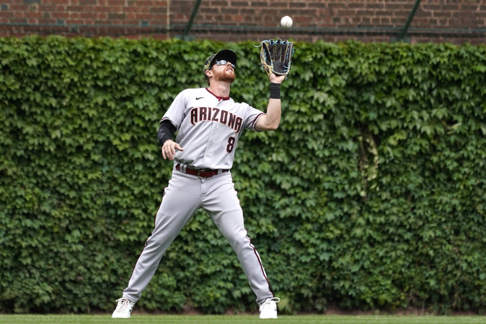 Arizona Diamondbacks left fielder Jordan Luplow catches a fly ball by Chicago Cubs' Rafael Ortega during the first inning of a baseball game in Chicago, Sunday, May 22, 2022. (AP Photo/Nam Y. Huh)